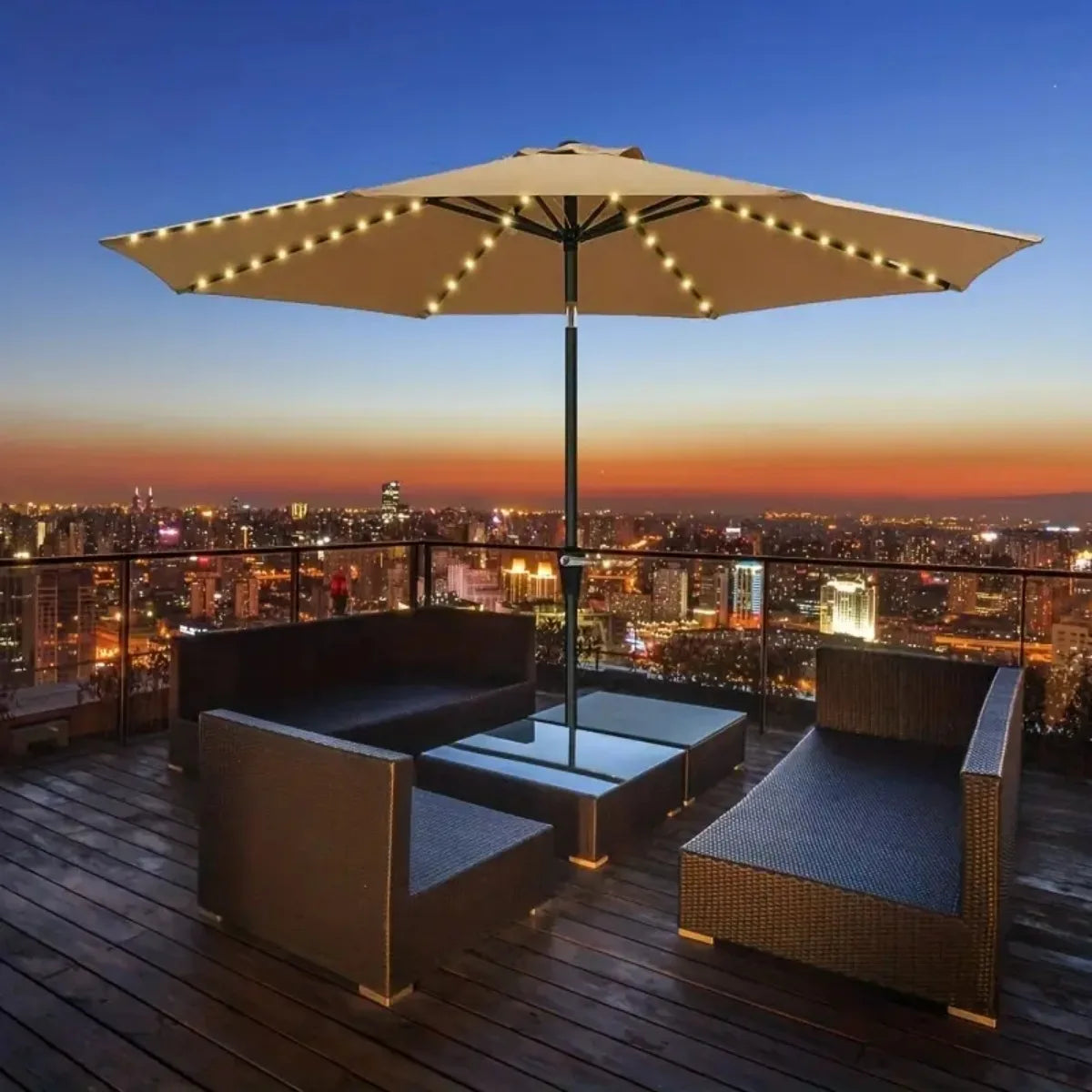 A patio umbrella light with a large canopy illuminating an outdoor seating area at dusk.