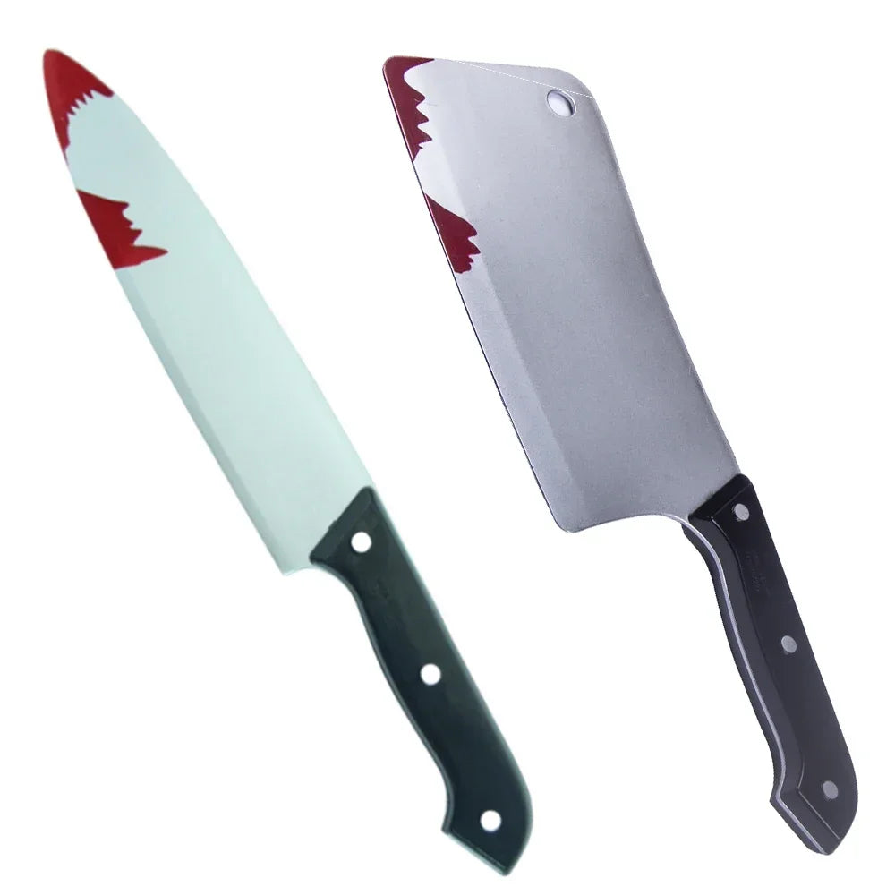 A silver knife prop with a red blood stain on the blade and a black handle.