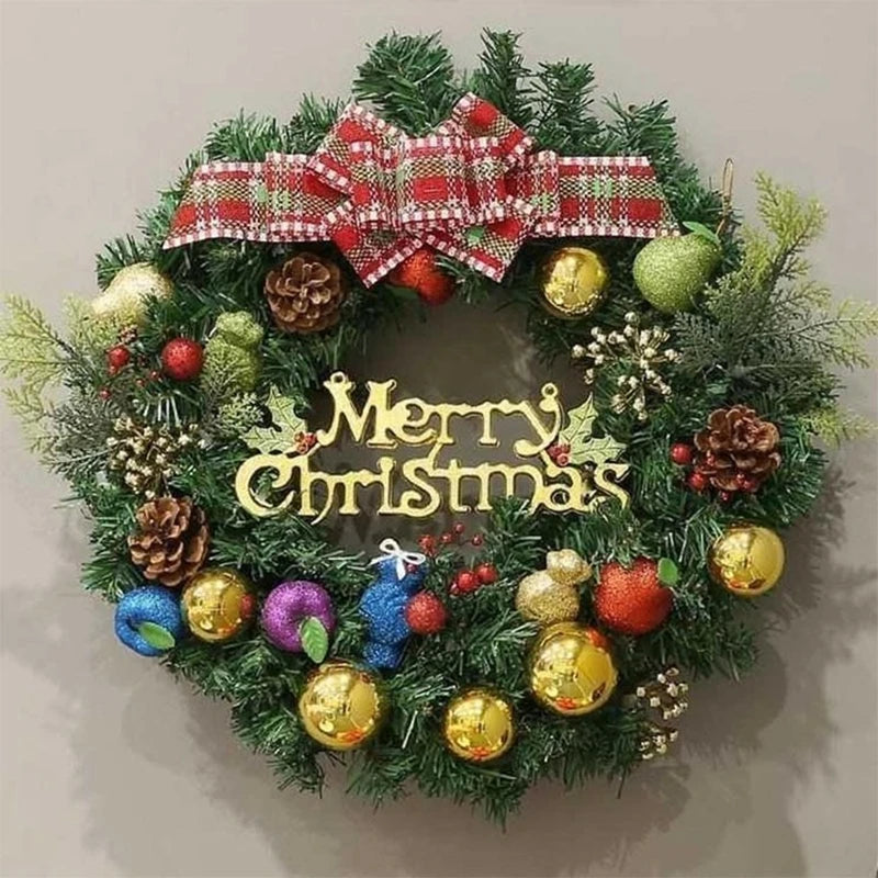 A festive Christmas wreath decorated with pine greenery, red plaid ribbon, and gold and green ornaments.