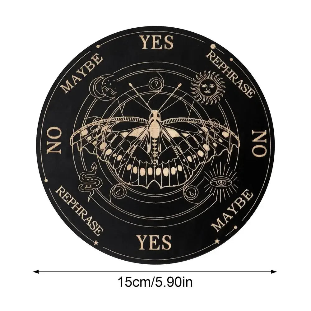 A black wooden divination board with celestial symbols and yes no maybe rephrase options around a central design.