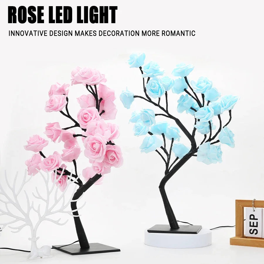 Lampe LED d'arbre de roses noires avec des roses roses et bleues sur fond blanc.