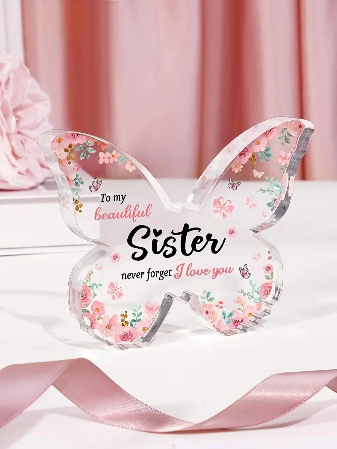 Clear acrylic butterfly keepsake with pink floral designs and the message To my beautiful sister never forget I love you