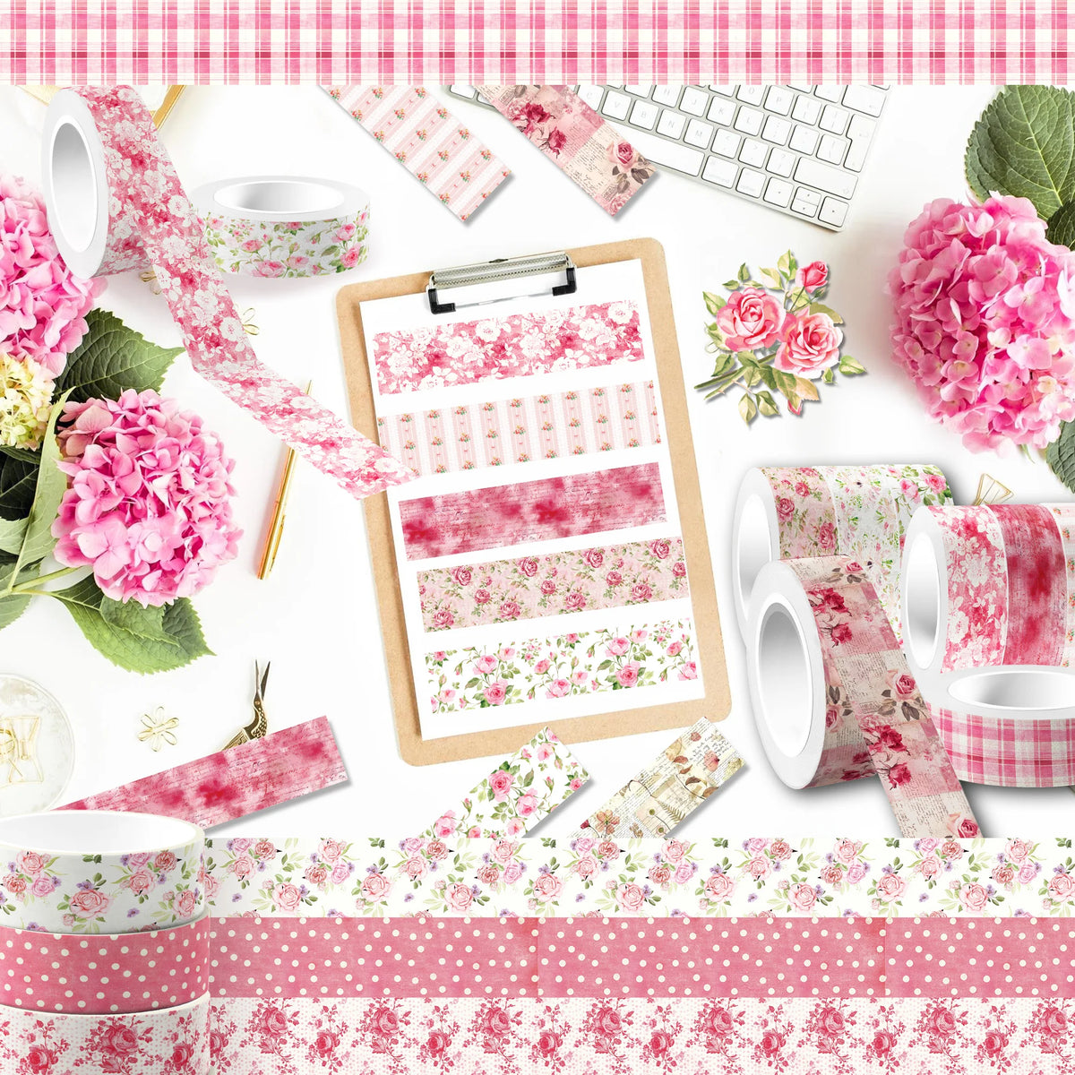 A collection of pink and green floral patterned washi tape rolls, decorative paper, and a wooden clipboard with tape samples.