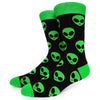 Black crew socks with neon green alien prints and a neon green cuff.