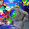 A black outdoor LED projector light with a colorful patterned lens is shown against a festive Christmas and Halloween backgro
