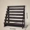 A black multilayer wooden earring organizer displaying jewelry on individual slots.