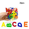 A set of 26 magnetic alphabet letters in various colors, including A, B, C, and E, held in a hand.