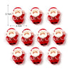 Un set de lindos imanes navideños para nevera con caras sonrientes de Santa en rojo y blanco.