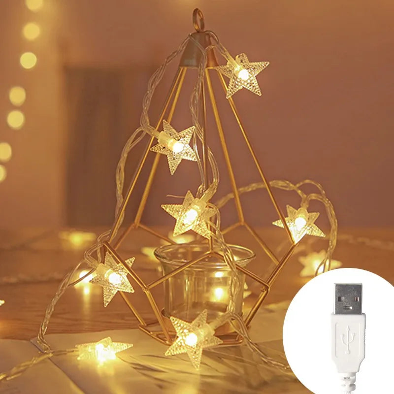 Golden wireframe star light decoration with LED fairy lights powered by a USB cable
