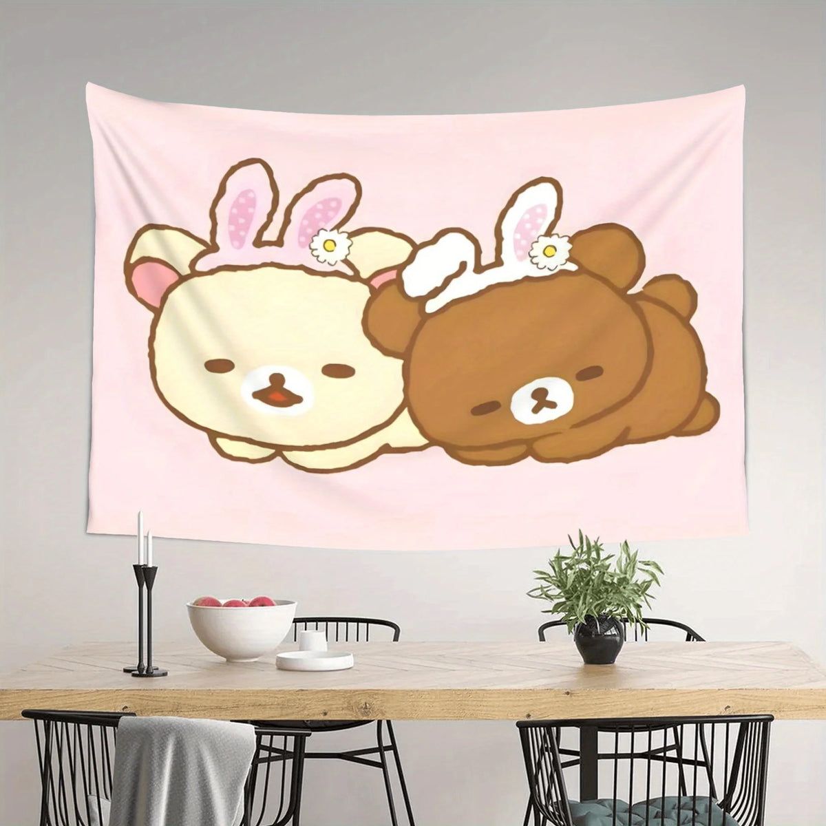 A pink tapestry featuring a cute cartoon bear design with pink ears and white accents.
