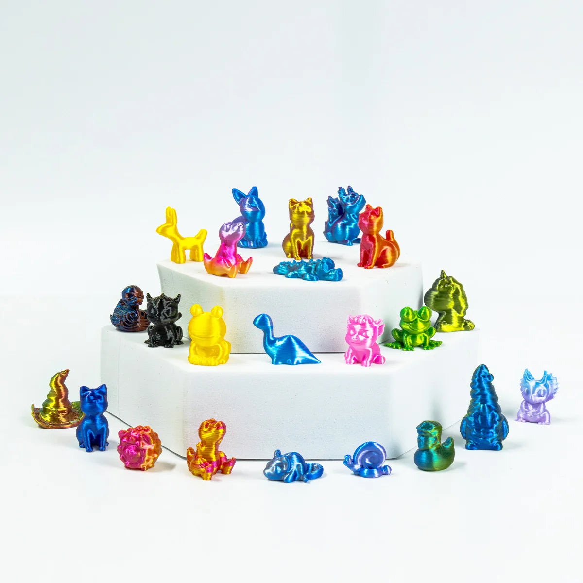 A collection of colorful mini animal figurines arranged on a white circular base.