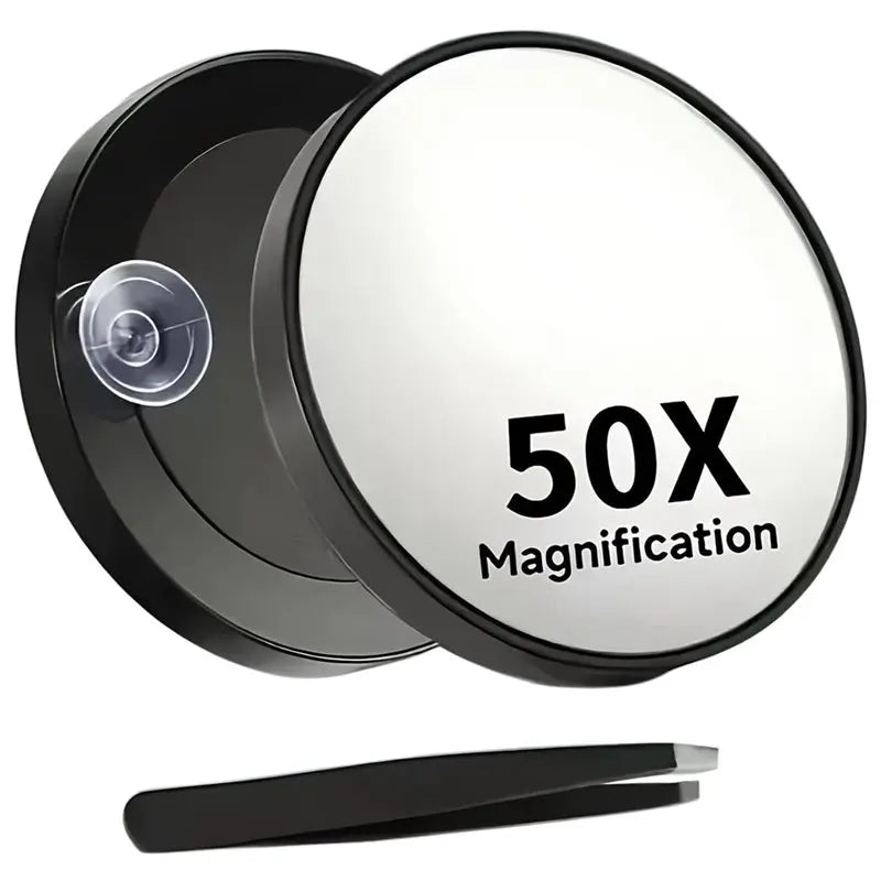 A black magnifying makeup mirror with a suction cup mount and a black handle.