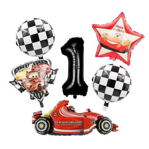 A set of birthday racing car party decorations including a star, balloons, and a red race car model.