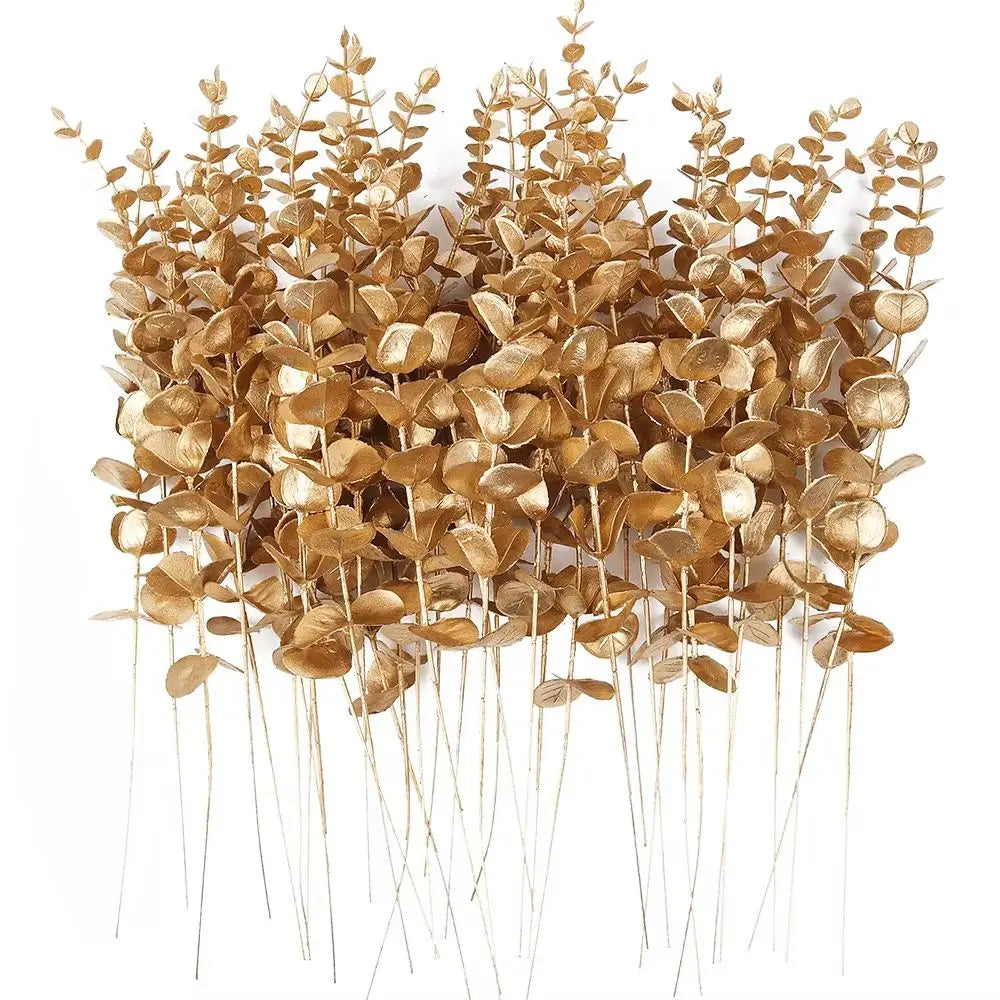 A bundle of dried, golden artificial eucalyptus leaves used for home and party decoration.