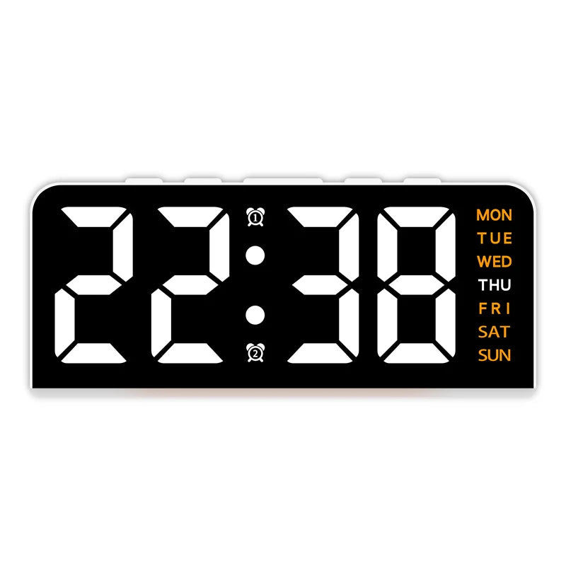 A black digital alarm clock displaying 22:38 with a mood light and day of the week indicator.