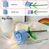 A light blue DIY rose flower building block with green stem and leaves, shown next to a white vase.
