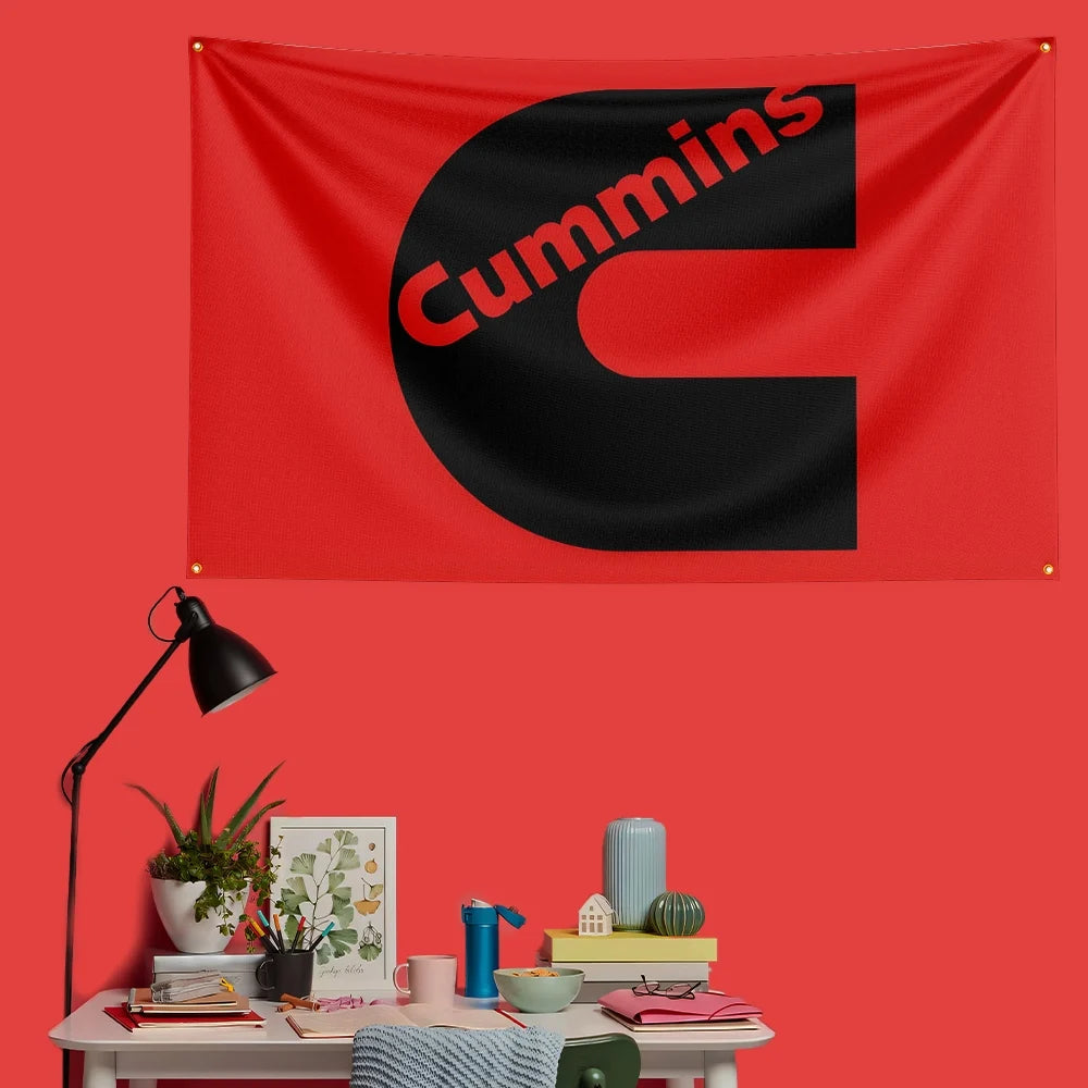 A red flag banner featuring a large black letter C with the word Cummins printed in red text.