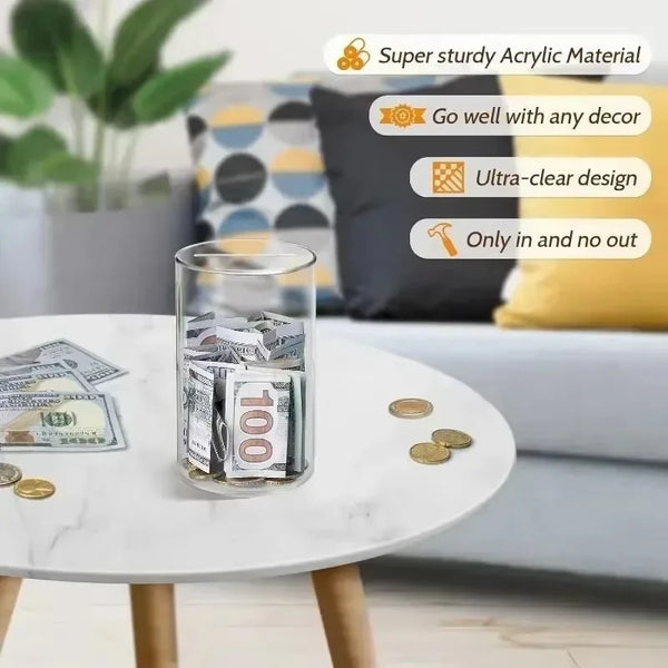 A transparent acrylic money saving jar filled with US currency sitting on a white marble table.