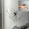 Eine Spinne auf einer weißen Oberfläche mit Maßeinheiten, die ihre Größe anzeigen.