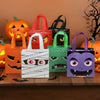 A collection of Halloween party treat bags featuring pumpkin and ghost designs in orange, red, black, green, and purple.