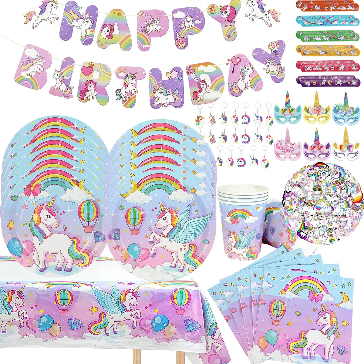 A collection of unicorn themed birthday party supplies including decorations, banners, and colorful items.