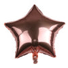A shiny bronze foil star balloon with a heart shape attached.