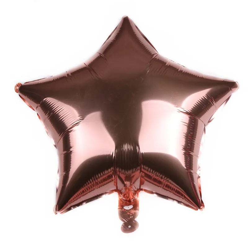 A shiny bronze foil star balloon with a heart shape attached.