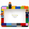 A LEGO minifigure framed within a colorful LEGO building block frame, demonstrating a DIY photo frame kit.