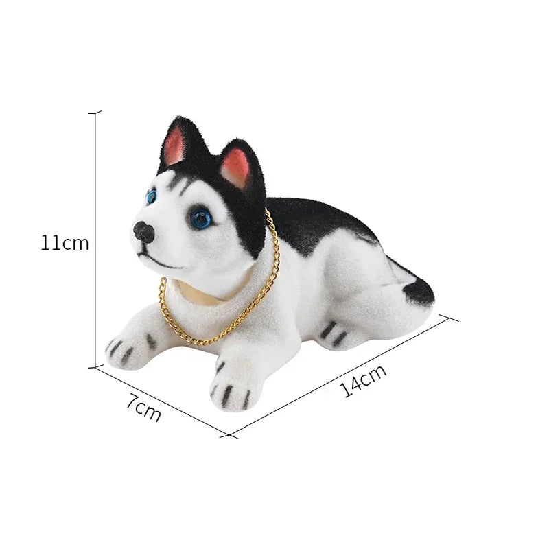 A white and black dog ornament figure with blue eyes, shown from the side.