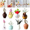 A set of eight magnetic mini ceramic vases in various colors and textures.