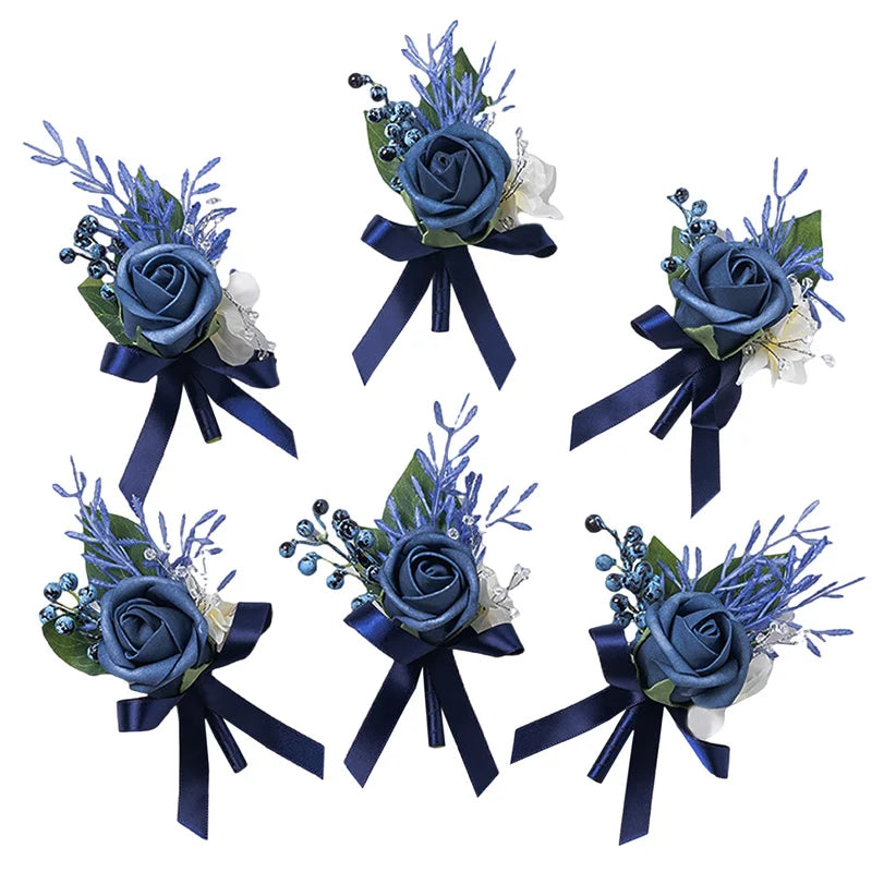 A set of six dusty blue silk rose boutonnieres featuring blue and silver floral accents.