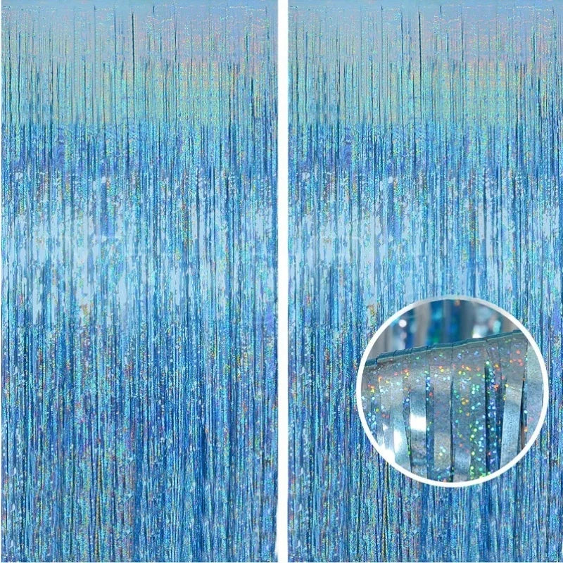 Close-up of metallic foil tinsel fringe backdrop showing shimmering blue and silver strands.