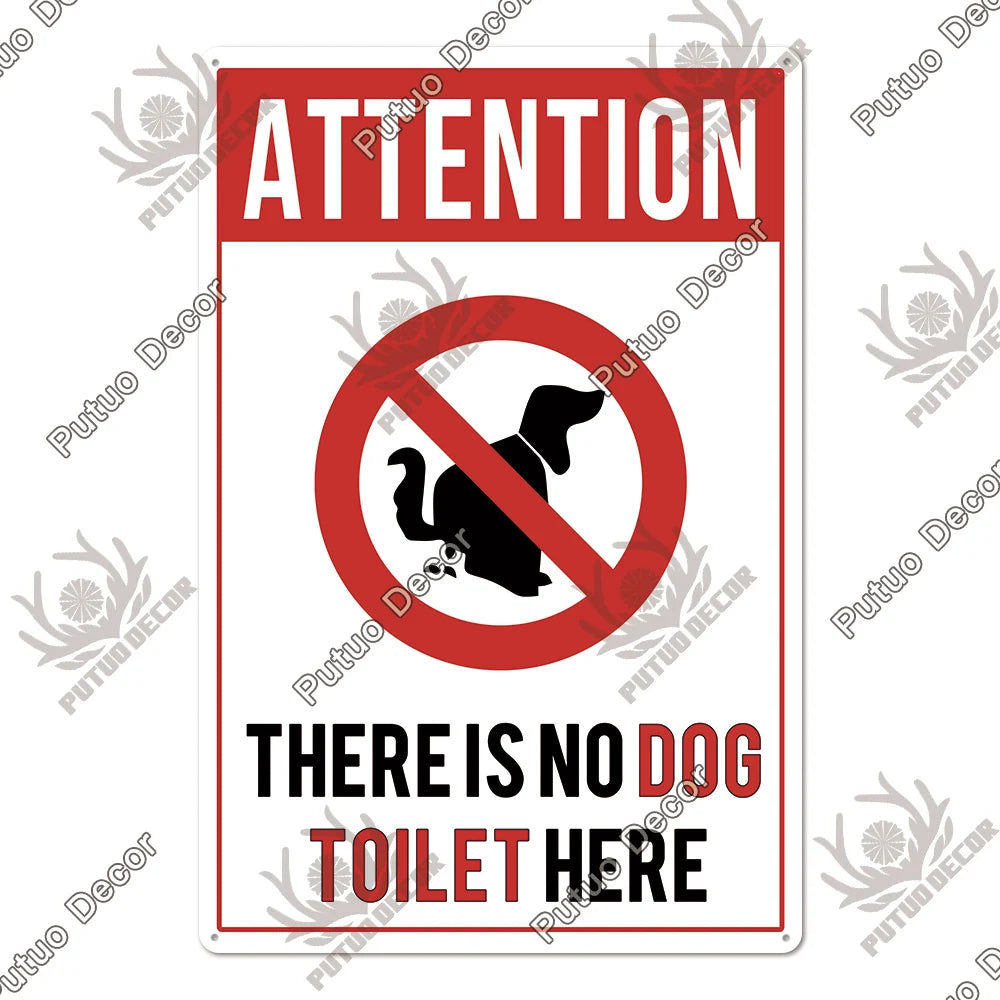 A vintage warning metal sign with a red circle and diagonal line prohibiting dogs, stating There is no dog toilet here.