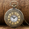 Vintage bronze quartz pocket watch with a chain, featuring an ornate dial and decorative engraving.