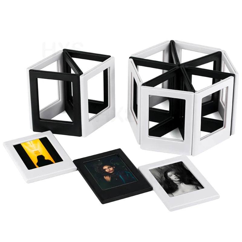 A set of black and white magnetic photo frames with a geometric design, including a hexagonal frame and several smaller recta