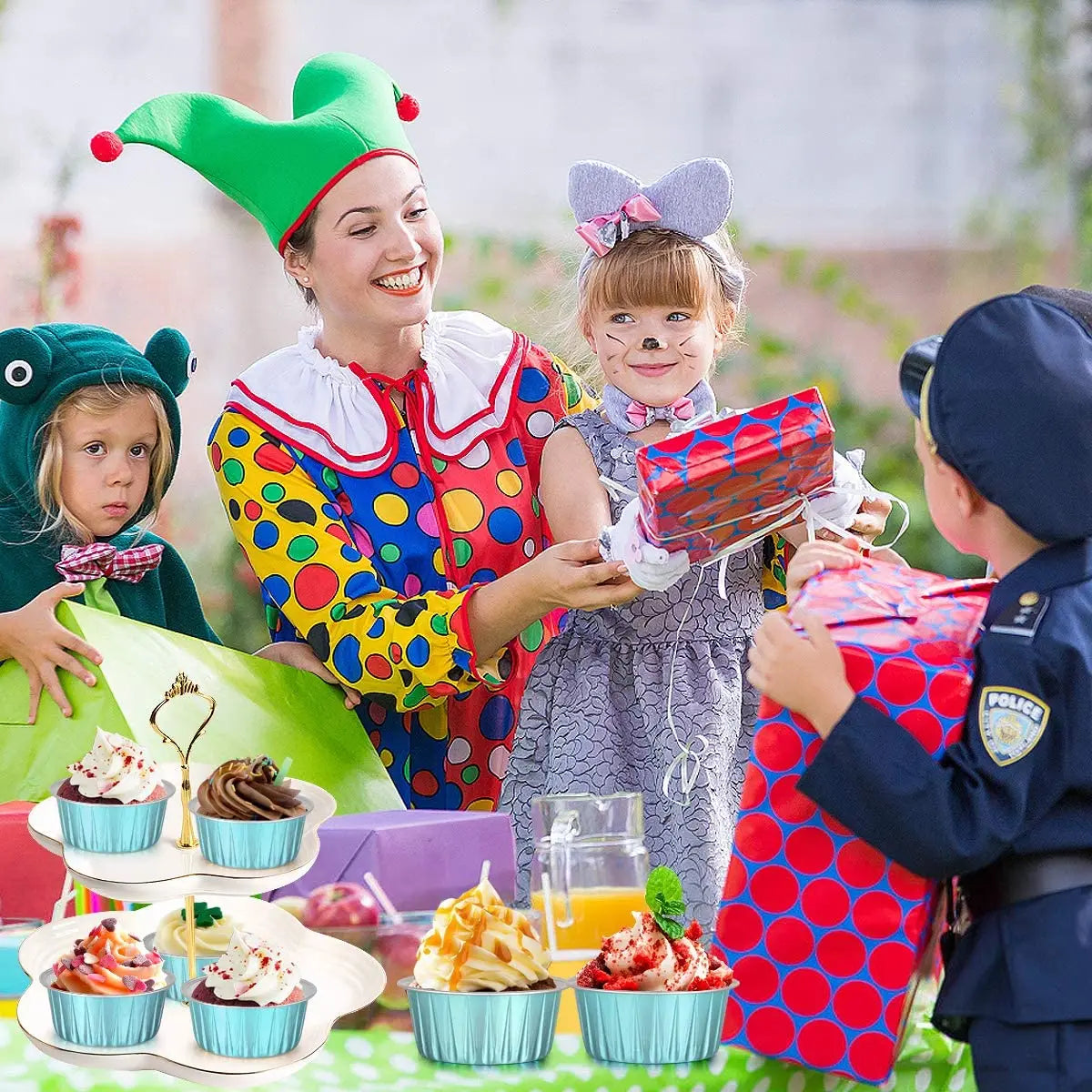 A child in a green elf costume is serving dessert ramekins to other children outdoors.