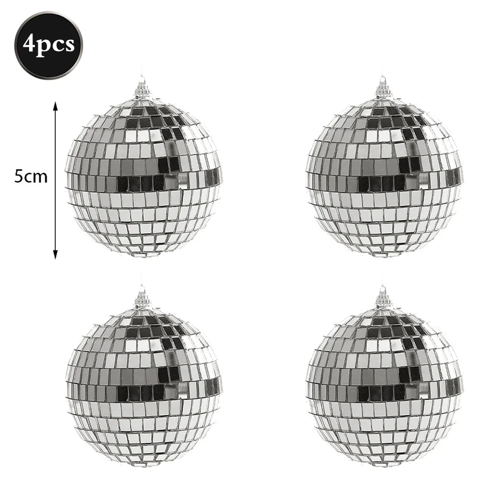 Four silver disco mirror balls shown in various angles and sizes for parties and decor