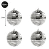 Four pieces of a silver mirror ball sphere with a hanging hook.