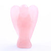 Hand-carved pink crystal figurine shaped like an angel for healing
