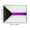 A square lapel pin featuring a black triangle and a horizontal purple stripe on a white background.