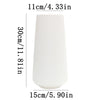 White ceramic vase with vertical ribbed texture, measuring 11cm high.
