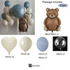 A package of balloons includes a brown teddy bear, various sized balloons, and ribbon.