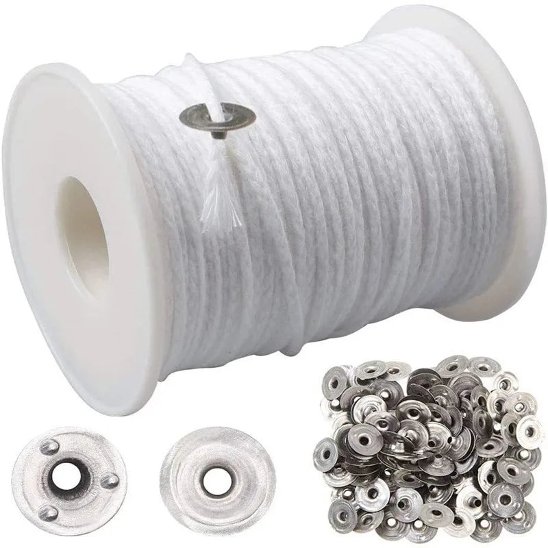 A spool of white braided cotton candle wicks and several small metal wick holders.