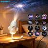 A white projector casts a galaxy pattern onto a wall, illuminating a display of various celestial bodies.