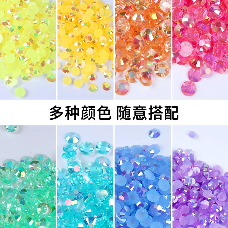 Assortment of colorful resin rhinestones in various shades including yellow, orange, pink, green, blue, and purple.