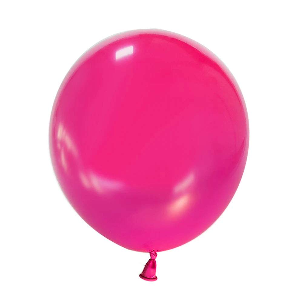 A single, glossy magenta latex balloon against a white background.