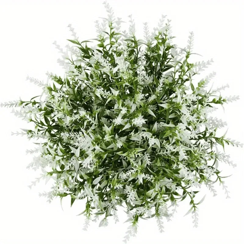 A dense bouquet of artificial white and green foliage used for home decor.