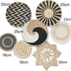 A collection of woven straw wall hangings and decorative circular pieces in various sizes and patterns.