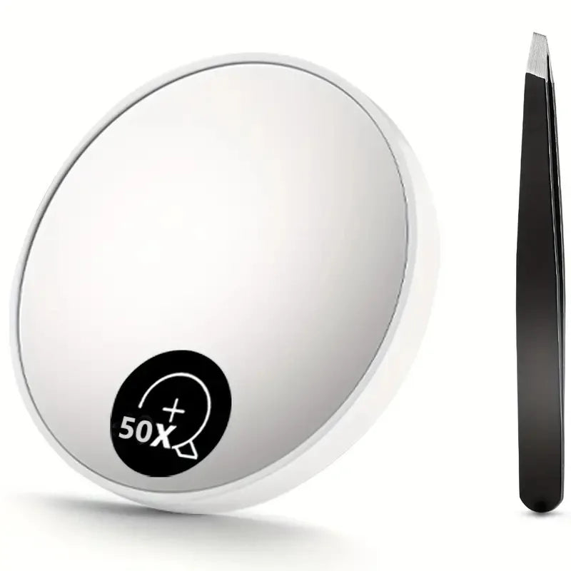 A round, white magnifying compact mirror with a suction cup and a black handle is shown.
