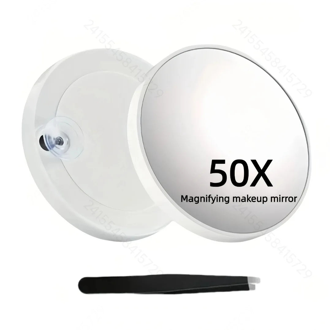 A white magnifying makeup mirror with a suction cup and a black handle is shown.
